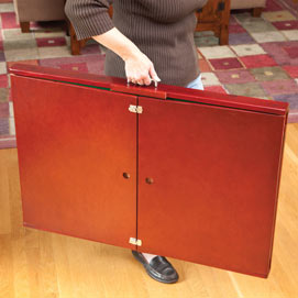 Someone carrying the foldable puzzle table on-the-go.